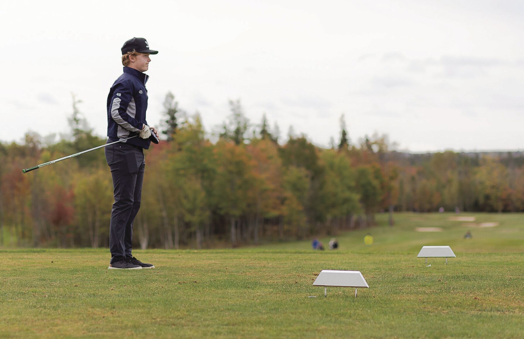 Thomas MacEachern watches for his first golf ball to land
